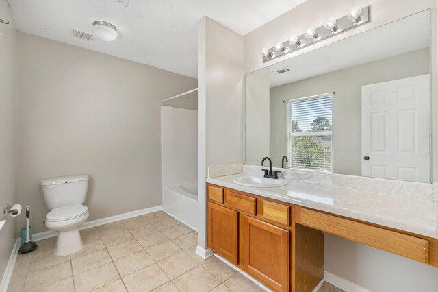 full bathroom with vanity, bathing tub / shower combination, toilet, and tile patterned flooring