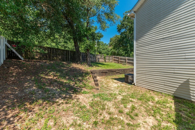 view of yard featuring a fenced backyard and cooling unit