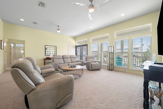 living room with ceiling fan and light carpet