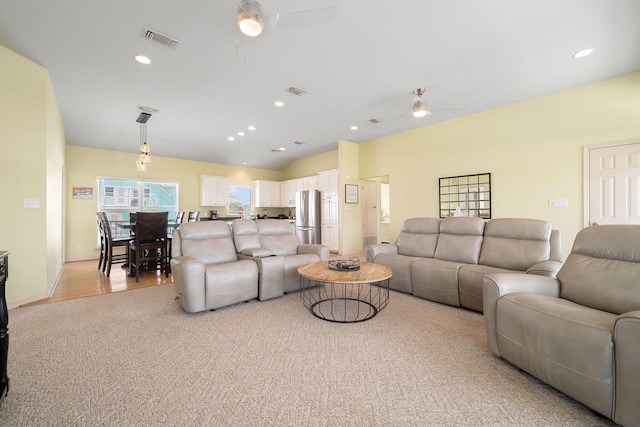 living room with vaulted ceiling and ceiling fan