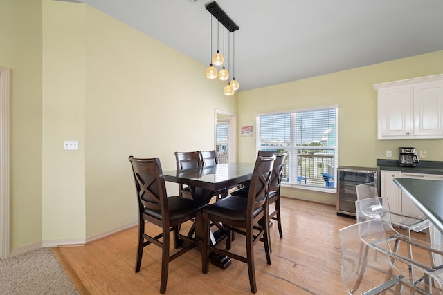 dining room featuring light hardwood / wood-style flooring and beverage cooler