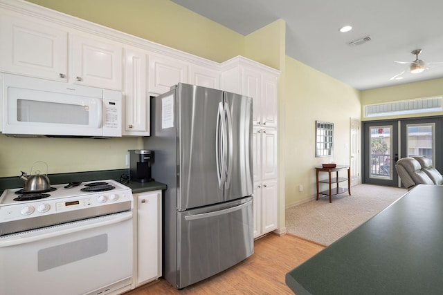 kitchen featuring white cabinets, white appliances, ceiling fan, light wood-type flooring, and french doors