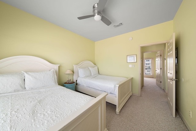 bedroom with ceiling fan and light colored carpet