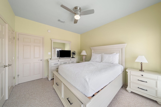 bedroom with light carpet and ceiling fan