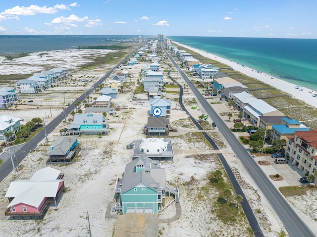 birds eye view of property featuring a view of the beach and a water view