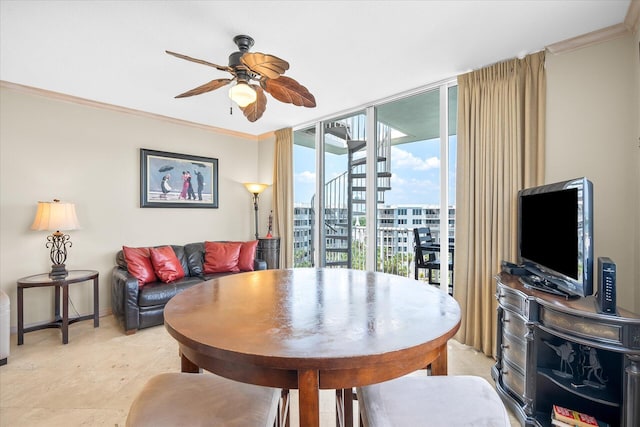 dining room featuring floor to ceiling windows, a ceiling fan, and crown molding