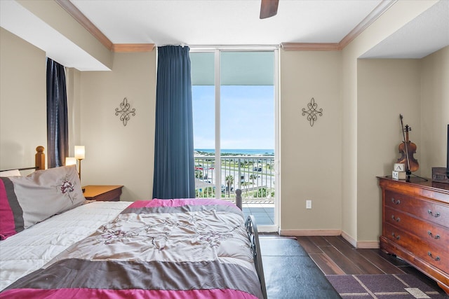 bedroom with access to exterior, floor to ceiling windows, crown molding, and wood finished floors