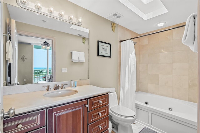 bathroom featuring toilet, a skylight, vanity, visible vents, and shower / tub combo with curtain