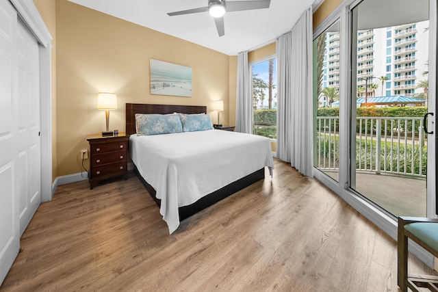 bedroom with ceiling fan and wood-type flooring