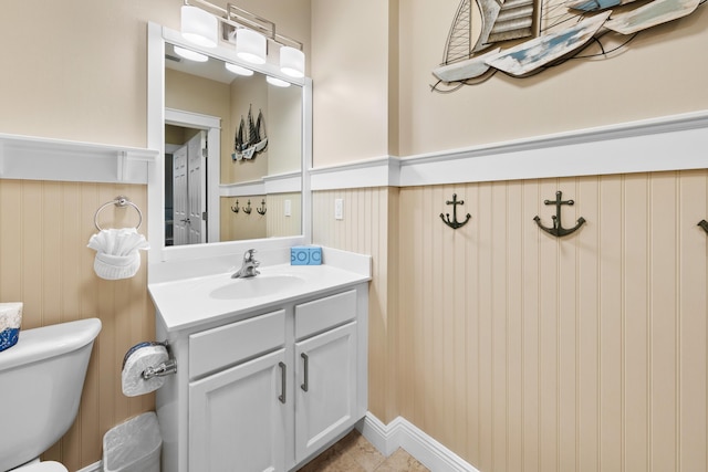 bathroom featuring vanity and toilet