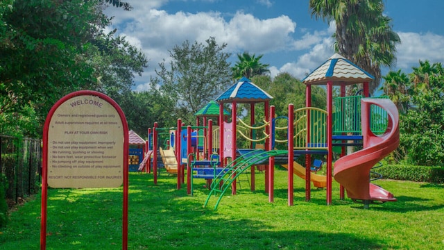 view of jungle gym featuring a lawn