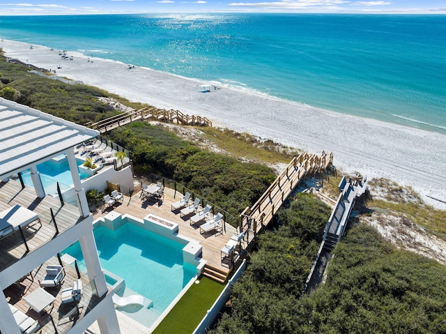 bird's eye view with a water view and a view of the beach