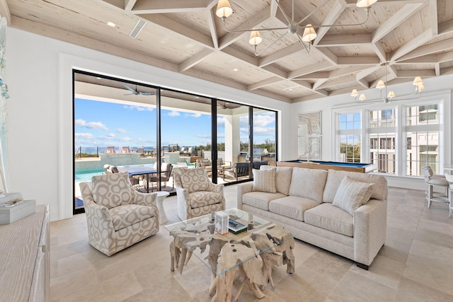 living room featuring beamed ceiling, light tile patterned flooring, and coffered ceiling