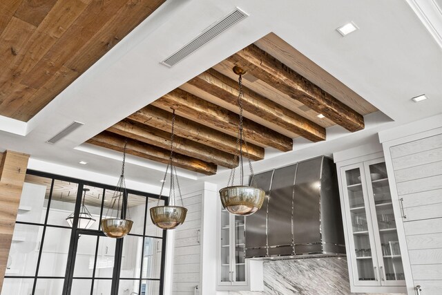 room details featuring beamed ceiling and hardwood / wood-style floors