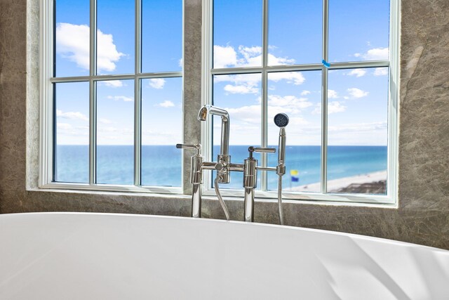 bathroom with sink and a water view