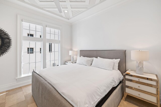 tiled bedroom featuring coffered ceiling, multiple windows, and ornamental molding