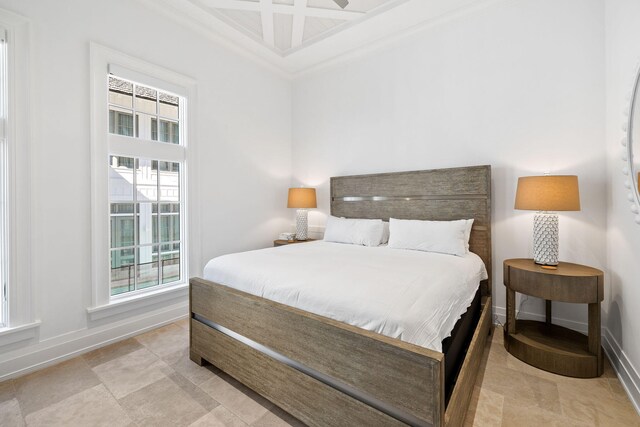 bedroom featuring light tile patterned flooring and ornamental molding