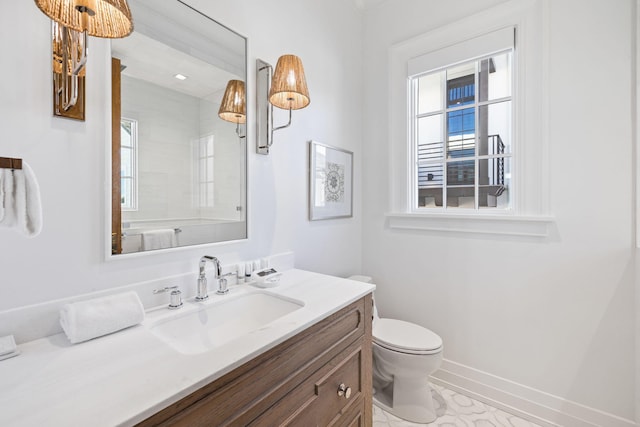 bathroom featuring toilet, tile patterned floors, and vanity