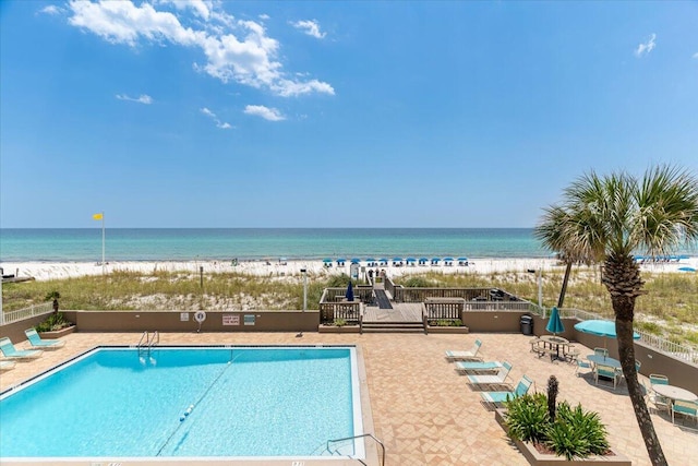 view of pool featuring a water view