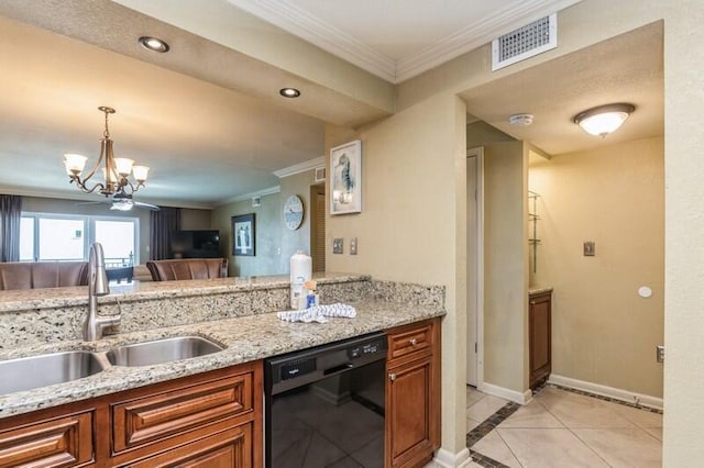 kitchen featuring black dishwasher, a sink, brown cabinetry, and visible vents