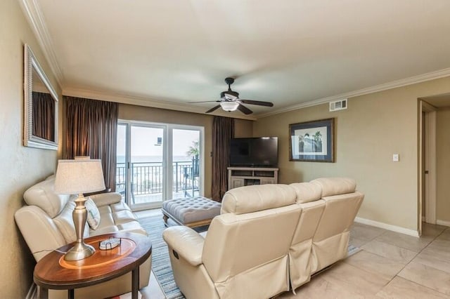 living room featuring crown molding, baseboards, visible vents, and a ceiling fan