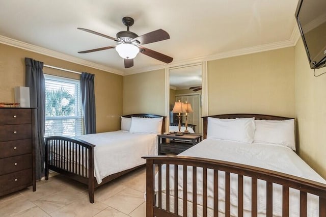 bedroom with a ceiling fan and ornamental molding
