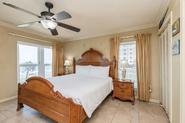 bedroom featuring baseboards, ceiling fan, and crown molding