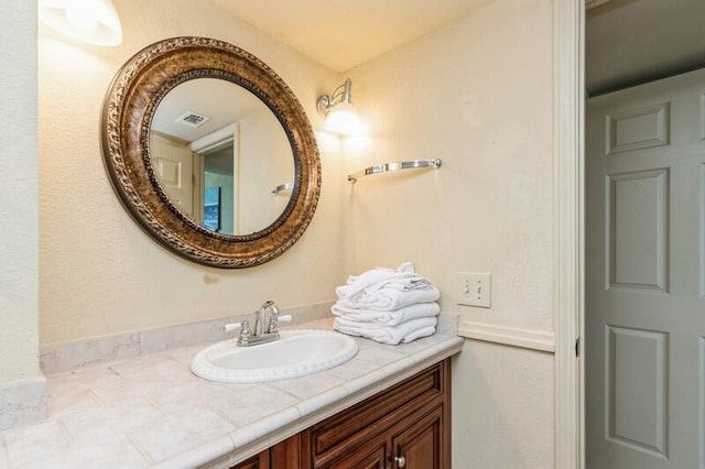 bathroom featuring visible vents and vanity