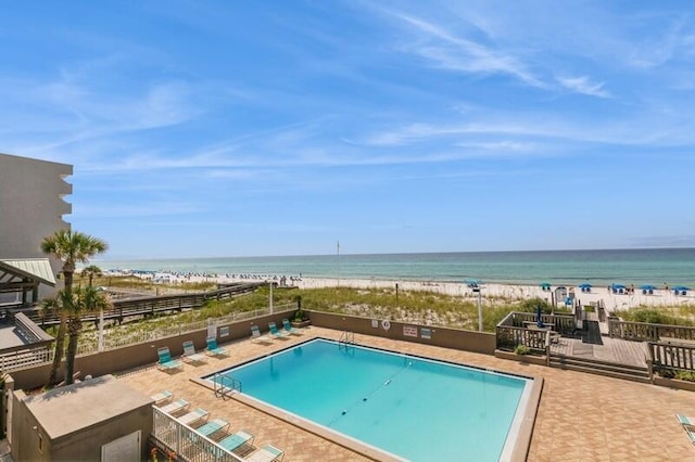 pool with a water view and a beach view
