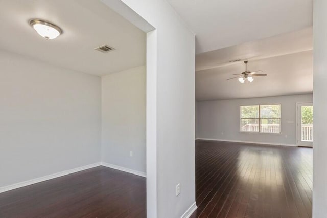 empty room featuring ceiling fan and dark hardwood / wood-style flooring