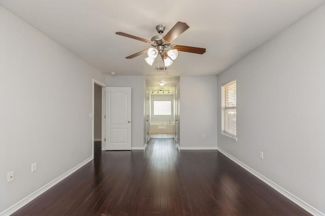 unfurnished room featuring dark hardwood / wood-style floors and ceiling fan