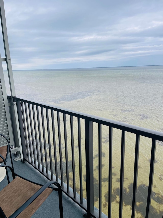 balcony featuring a water view