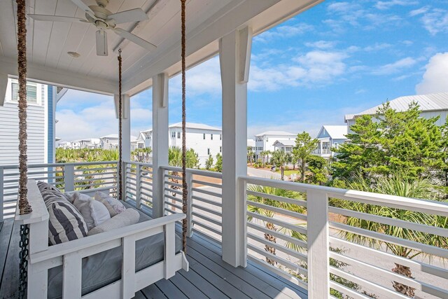 wooden terrace featuring ceiling fan