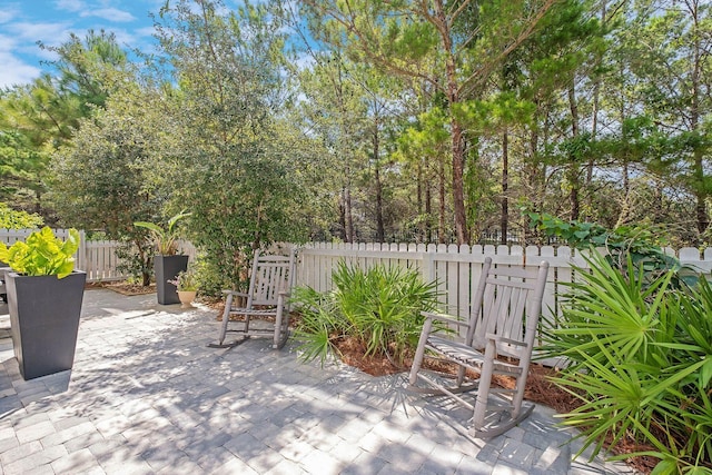 view of patio featuring fence