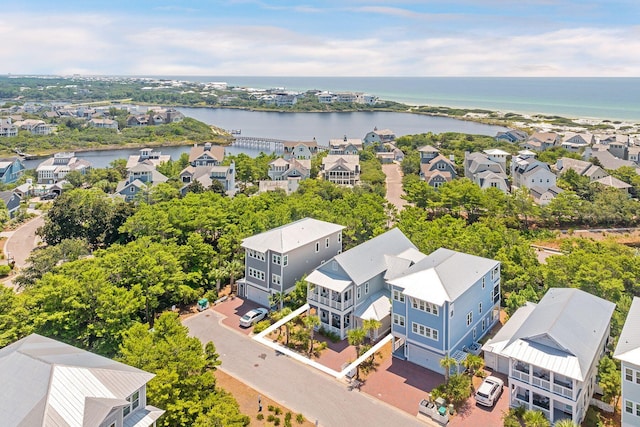 birds eye view of property with a residential view and a water view