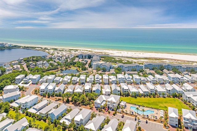 aerial view featuring a beach view, a residential view, and a water view