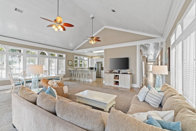 living room featuring ceiling fan and high vaulted ceiling