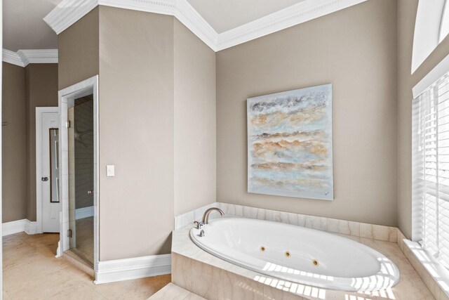 bathroom featuring a wealth of natural light, ornamental molding, and tile patterned flooring