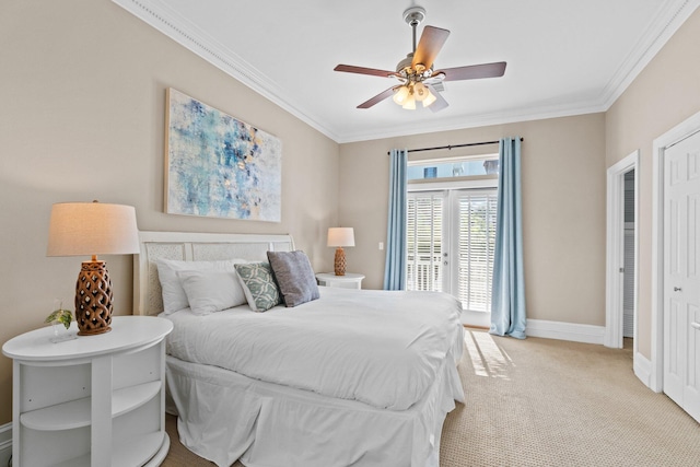 carpeted bedroom featuring ceiling fan and ornamental molding