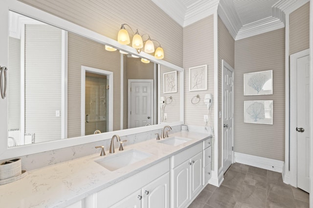 bathroom with vanity, an enclosed shower, crown molding, and tile patterned floors