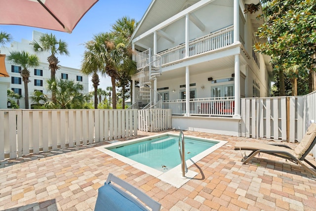 view of pool featuring a patio