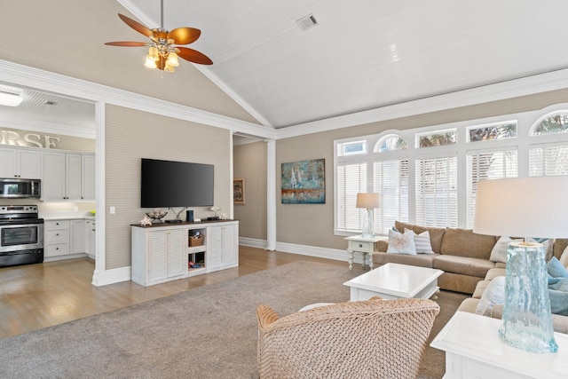 living room with high vaulted ceiling, light wood-type flooring, crown molding, and ceiling fan