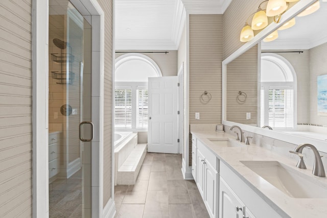 bathroom with dual vanity, crown molding, separate shower and tub, and tile patterned flooring