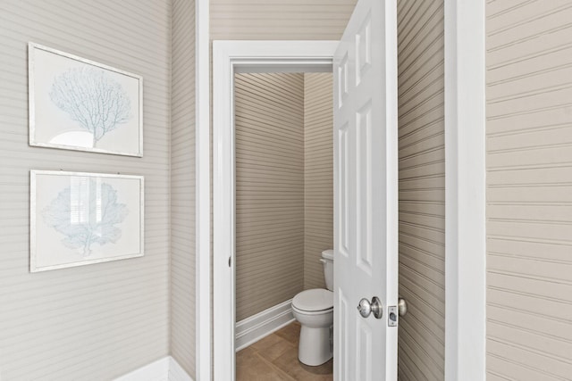 bathroom featuring tile patterned floors and toilet