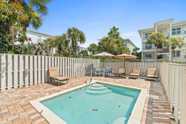 view of pool featuring a patio area