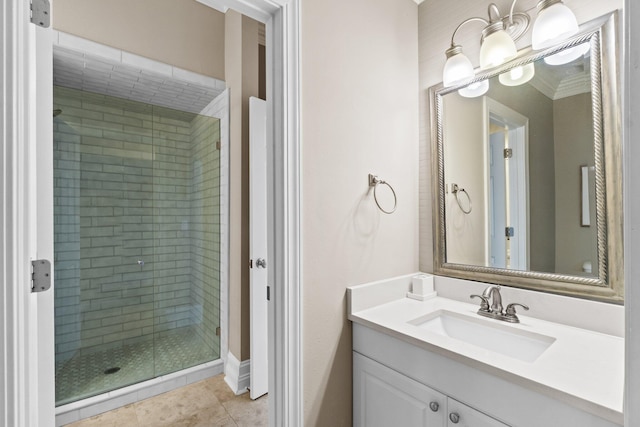 bathroom with tile patterned flooring, vanity, ornamental molding, and walk in shower