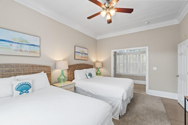 bedroom featuring wood-type flooring, ornamental molding, and ceiling fan