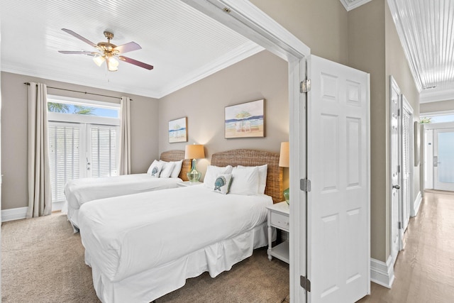 bedroom featuring ornamental molding, ceiling fan, and carpet floors