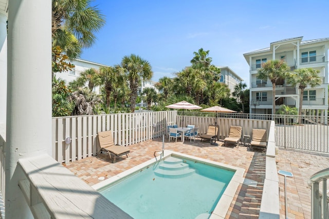 view of pool featuring a patio area