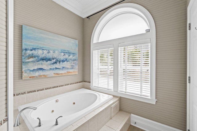 bathroom with crown molding and tiled bath